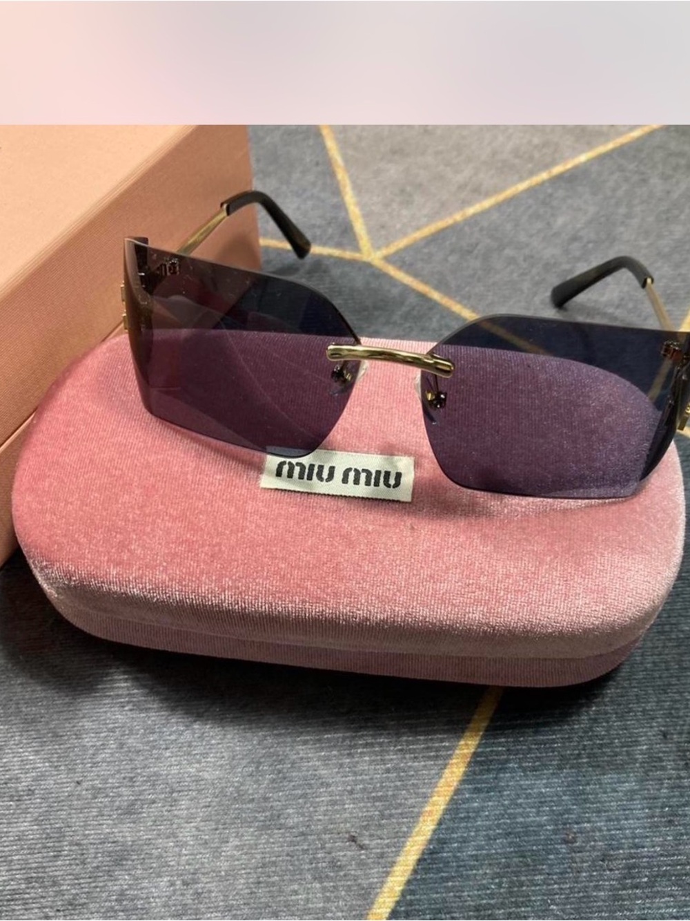 Miu Miu Rimless Sunglasses with Purple Gradient Lenses and Gold Bridge